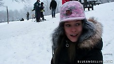 Hot teen has fun playing out in the cold snow with her cameraman