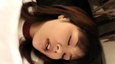 Sweet Japanese girl plays with a sex toy and reveals her oral skills