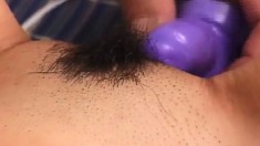 Petite Oriental beauty gets her tight hairy cunt pleased with sex toys