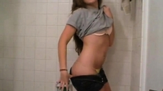 Girl undressing in the bathroom (not nude)